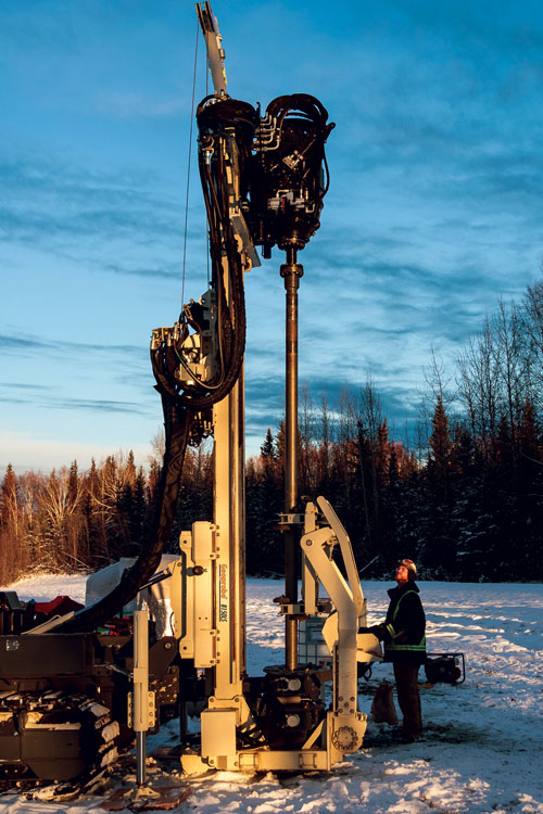 8150LS drills at -38 degrees Fahrenheit in alluvial sands and gravels of the Tanana Basin near Fairbanks, Alaska. Mobilized, complete with rod handler and GV5 50K sonic head, in a 40-foot container to investigate distribution of permafrost and install well clusters to evaluate vertical hydraulic gradients.