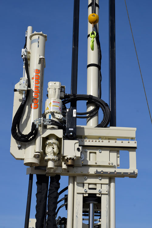 Slide automatic drop hammer into position using control panel on 3126GT drilling truck.